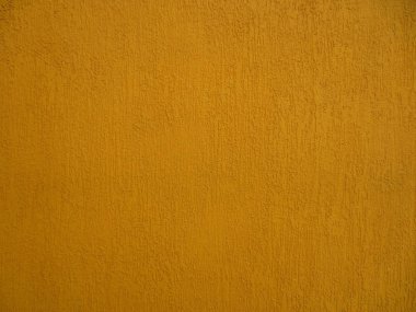 Dokulu zengin koyu sarı renk ile duvar.