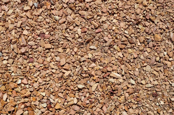 Light brown crushed stone on the track. — Stock Photo, Image