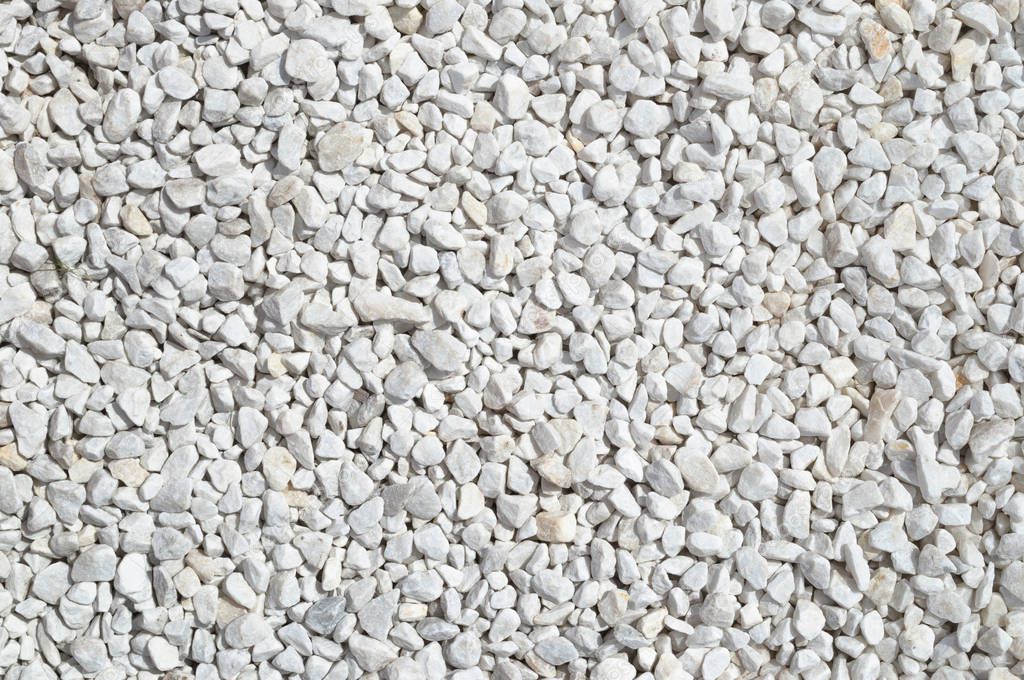 Light gray gravel on the path, light crushed stone texture.