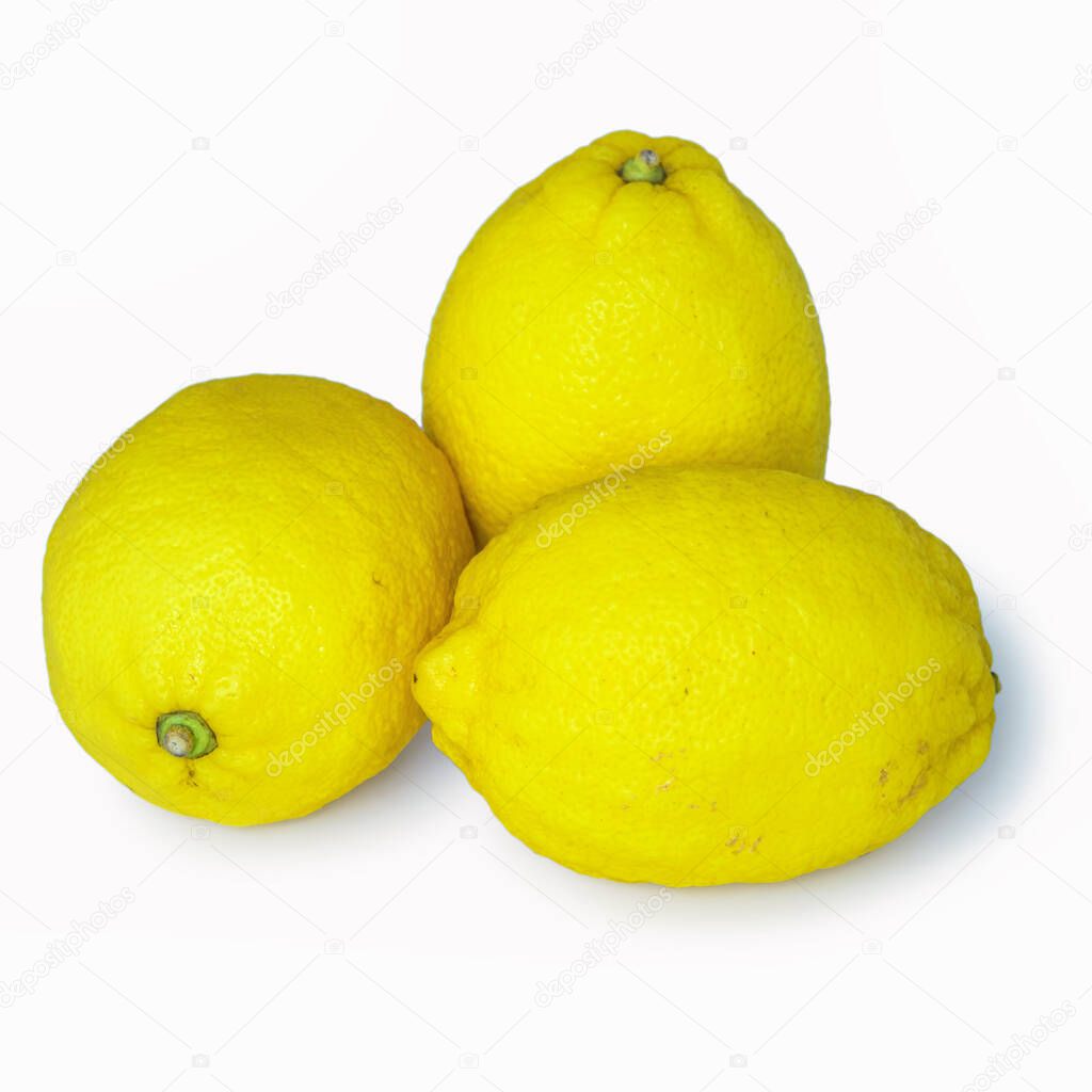 Three yellow fresh lemons.