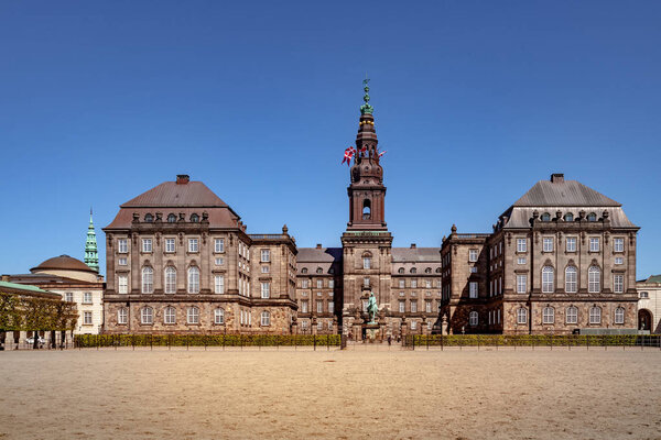 Urban scene with historical Christiansborg Palace and blue sky in Copenhagen, denmark