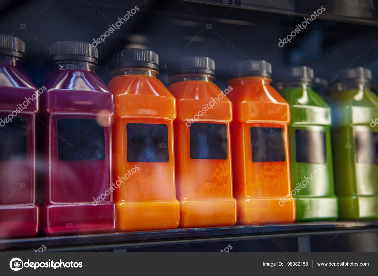 https://st4.depositphotos.com/17897224/19898/i/1600/depositphotos_198982158-stock-photo-different-types-fresh-juices-bottles.jpg