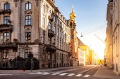 COPENHAGEN, DENMARK - MAY 6, 2018: cityscape with buildings and church with sunlight