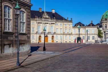 empty street and square with historical buildings and cathedral in copenhagen, denmark clipart