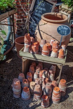 high angle view of various handmade ceramic pots and prices in copenhagen, denmark clipart