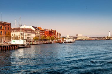 COPENHAGEN, DENMARK - MAY 6, 2018: cityscape and river with boats  clipart