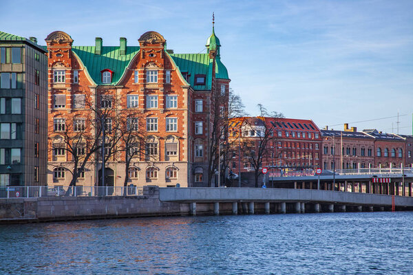 cityscape with buildings and river in Copenhagen, Denmark 