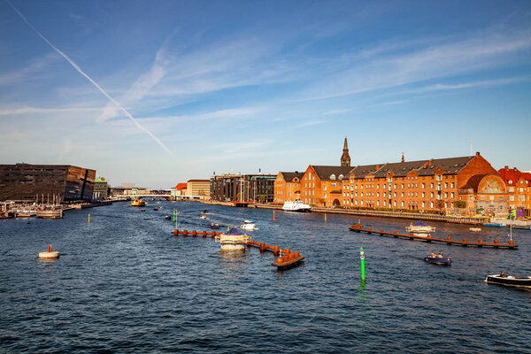 COPENHAGEN, DENMARK - MAY 6, 2018: aerial view of cityscape with river and boats 