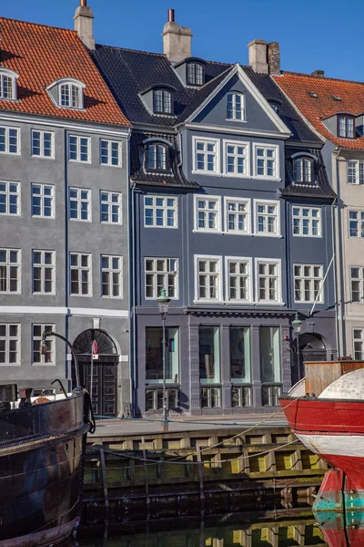 COPENHAGEN, DENMARK - MAY 6, 2018: beautiful historical buildings near water and moored boats in copenhagen, denmark — Stock Photo
