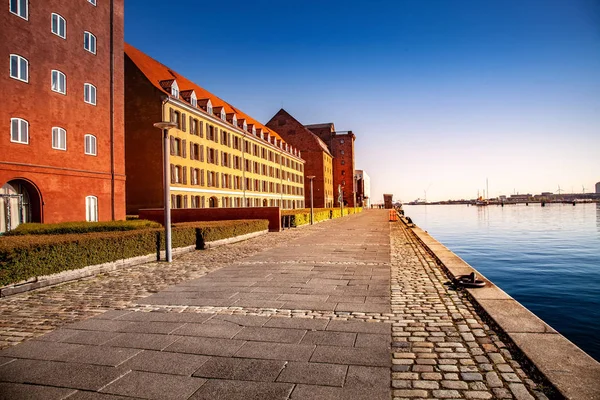 Empty embankment near harbor and buildings at sunny day, copenhagen, denmark — Stock Photo