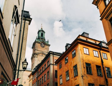 urban scene with beautiful colorful buildings in old town of Stockholm, Sweden clipart