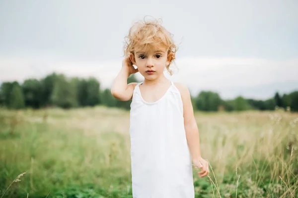 Adorable Child Curly Hair Standing Field Looking Camera — Stock Photo, Image