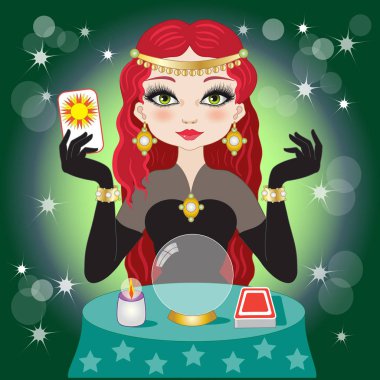 Kristal top ve tarot ile yeşil bir arka plan üzerinde kırmızı saçlı güzel falcı