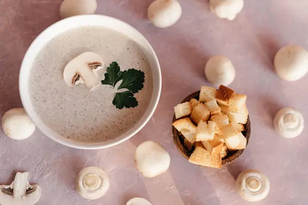 Creamy mushroom cream soup with champignons serving in delicate pink colors — Stock Image Creamy Mushroom Cream Soup Champignons Serving Delicate Pink Colors Royalty Free Stock Images