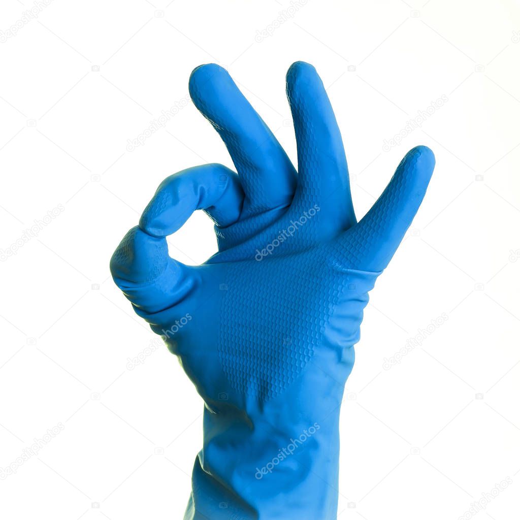 Hand in blue glove on a white background, isolated