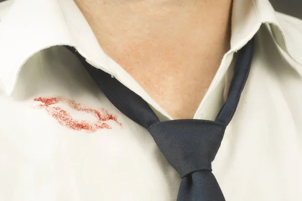 A trace of lipstick on a man's shirt