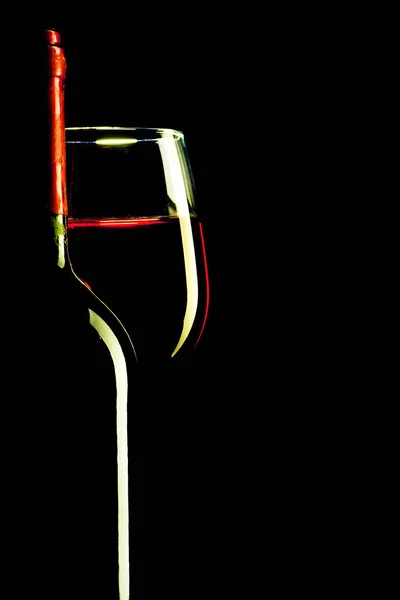 The outline of a glass with a bottle on a black background — Stock Photo, Image