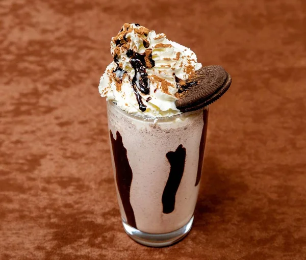 Cocktail from ice cream, juice of cream, chocolate, cocoa and chocolate biscuits