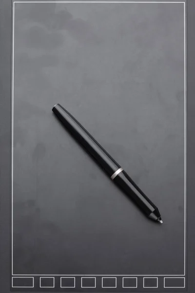 graphic tablet with pen, for illustrators, designers and retouchers, black on a white background.