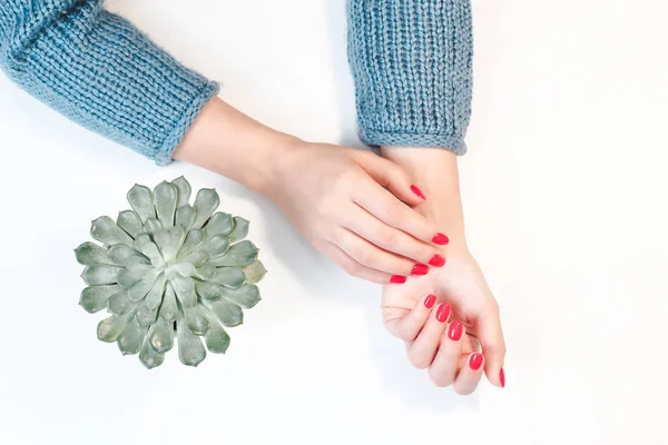 Perfect groomed womans hands with red nail varnish. — Stockfoto