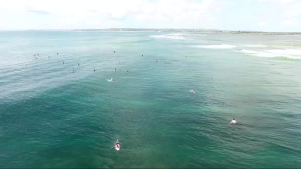Surfers waiting of ocean wave to ride - Bali — Stock Video
