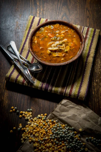 Rustic homecooked hearty tomato vegetable soup in a wooden bowl — Stock Image Rustic Homecooked Hearty Tomato Vegetable Soup Wooden Bowl Stock Picture
