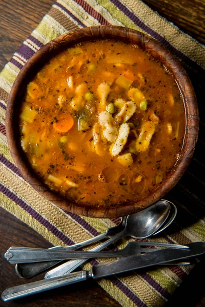 Rustic homecooked hearty tomato vegetable soup in a wooden bowl — Stock Image Rustic Homecooked Hearty Tomato Vegetable Soup Wooden Bowl Royalty Free Stock Photos