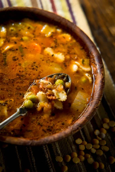 Rustic homecooked hearty tomato vegetable soup in a wooden bowl — Stock Image Rustic Homecooked Hearty Tomato Vegetable Soup Wooden Bowl Royalty Free Stock Images