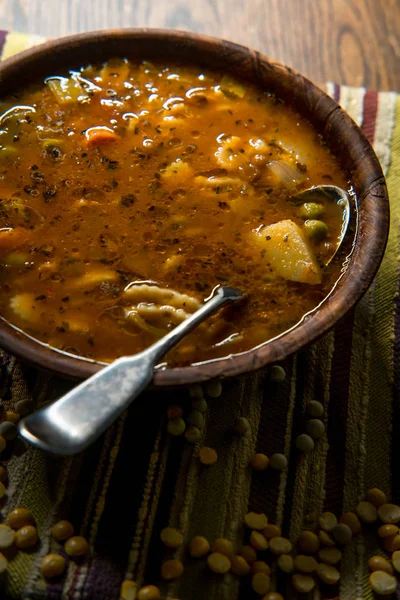 Rustic homecooked hearty tomato vegetable soup in a wooden bowl — Stock Image Rustic Homecooked Hearty Tomato Vegetable Soup Wooden Bowl Stock Photo