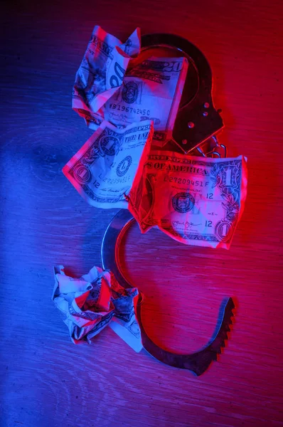 Conceptual Handcuffs Crumpled Dollar Bills Police Lights — Stock Photo, Image