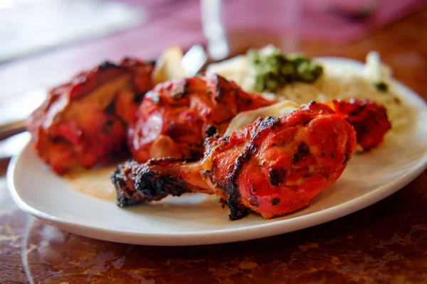 Indian tandoori chicken with mint chutney and basmati rice