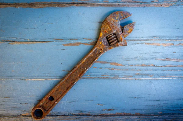 Old Rusty Adjustable Wrench Contractors Tool Worn Wooden Floor — Stock Photo, Image