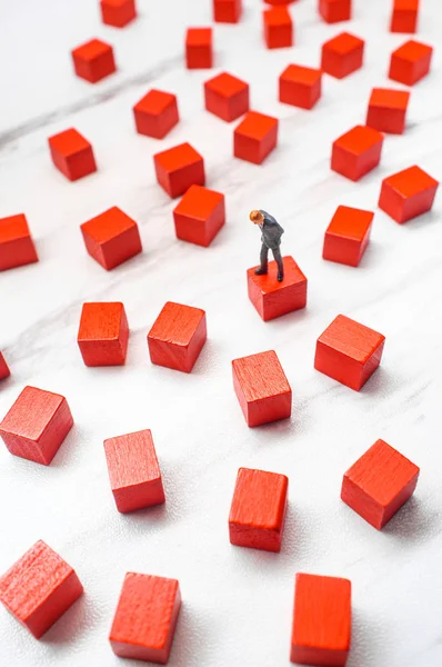 Miniature Businessmen Surrounded Wooden Blocks Representing Possible Choices Solutions Problem — Stock Photo, Image