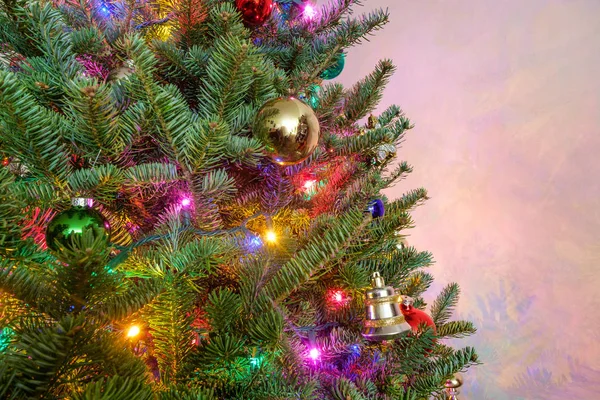 Seasonal holiday Christmas tree with decorations and string lights