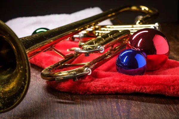 Seasonal Christmas and the holidays musical instrument trumpet with dramatic lighting