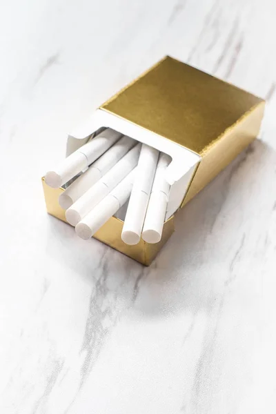 Open Half Empty Gold Pack Cigarettes Marble Kitchen Table — Stock Photo, Image