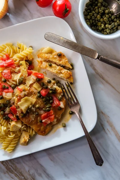 Italian Chicken Piccata Artichoke Hearts Capers Served Fusilli Pasta — Stock Photo, Image