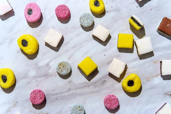 Colorful gourmet English licorice candies on marble table