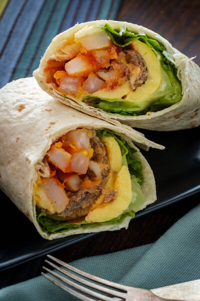 Egg and sausage with cheese American breakfast sandwich wrap