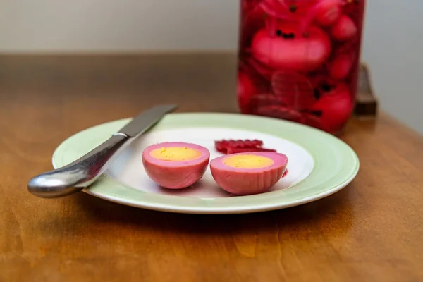 Sliced organic pickled beet eggs on wooden table — Stock Image Sliced Organic Pickled Beet Eggs Wooden Table Royalty Free Stock Images