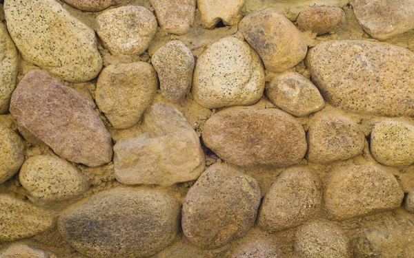 fence of stones close up. Background stone fence