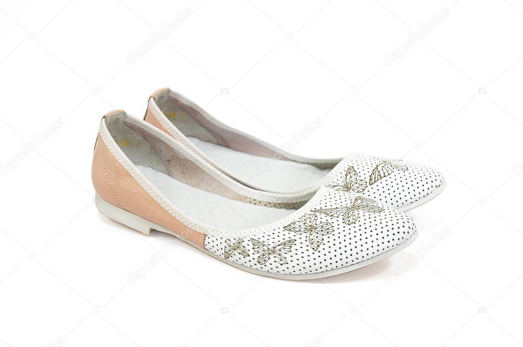 white ballet flats with a flower