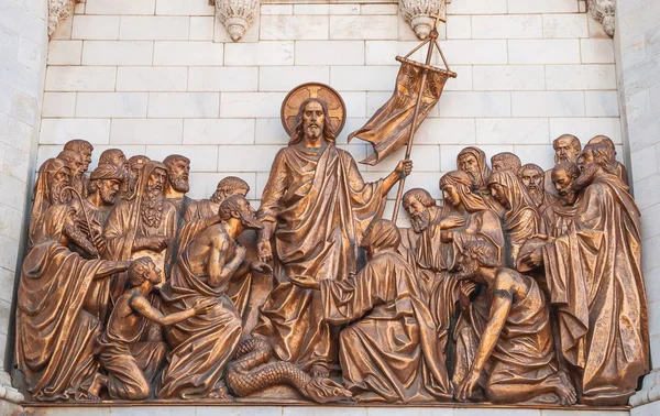 Jesus with the apostles and disciples. High relief on the wall of the Cathedral of Christ the Savior in Moscow