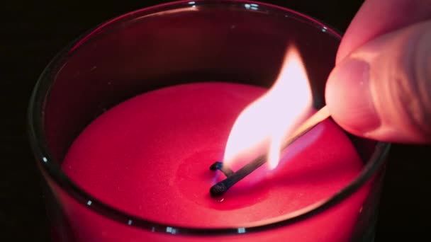Burning a pink candle in a dusty glass — Stock Video