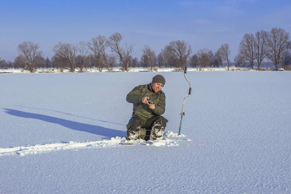 Winter Fishing Concept Fisherman Action Catching Fish Snowy Ice — Stock Photo, Image