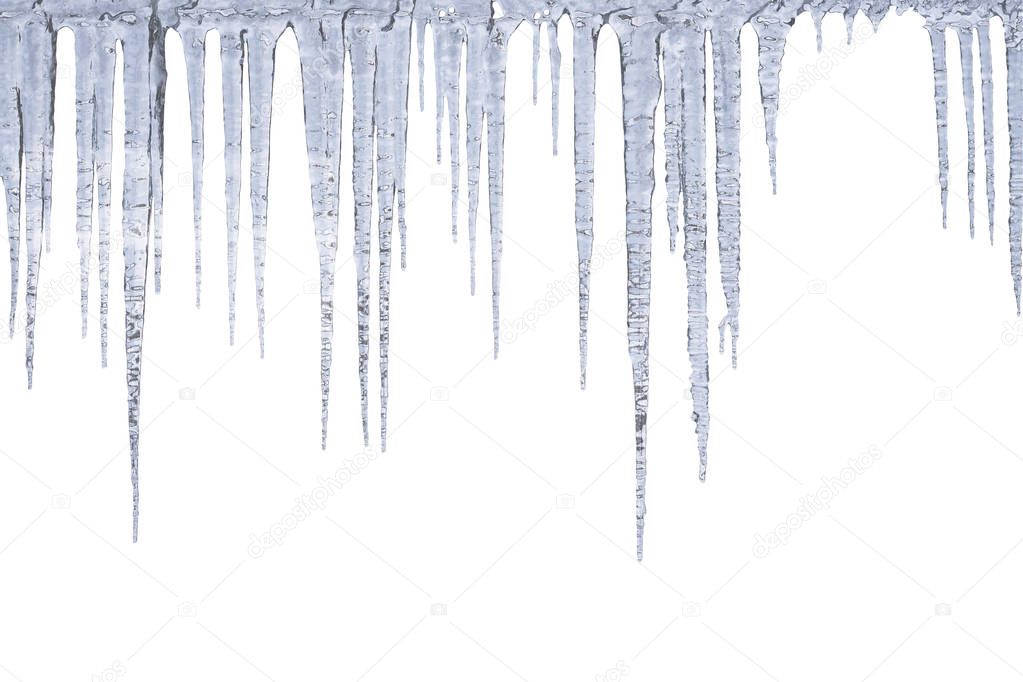 Winter icicles hang from top, isolated on white background