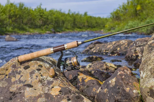 Fishing Spinning Rod Reel River Stones Royalty Free Stock Photos