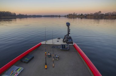 Fishfinder, echolot, fishing sonar at the boat with fishing tackles clipart