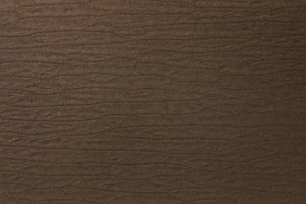Bruine papieren textuur met reliëf en stempelen — Stockfoto