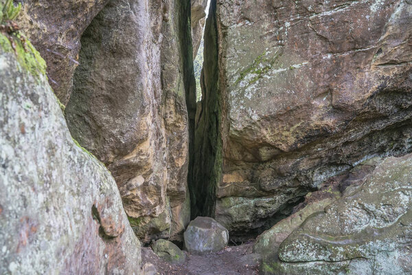 Crack split of stone rock. Ternoshorska Lada. Dovbush rocks. Car